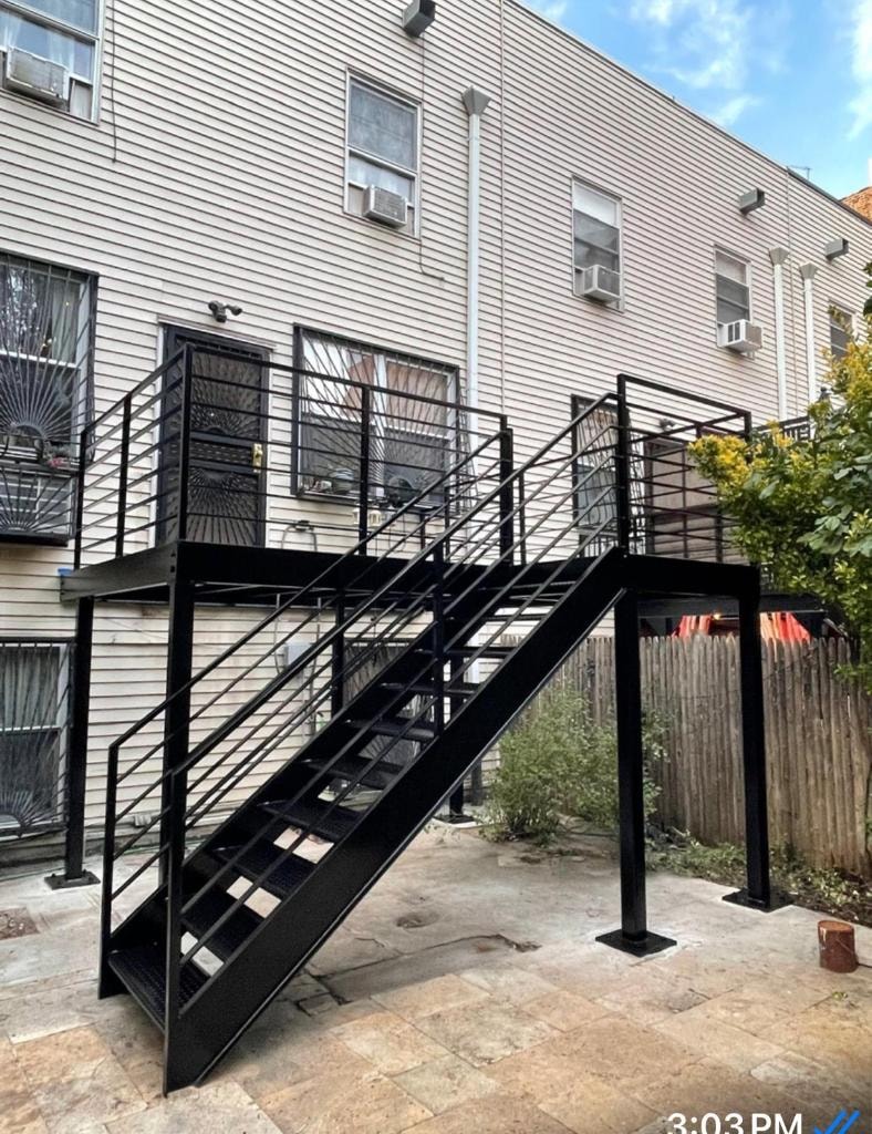 Black metal staircase on modern residential building