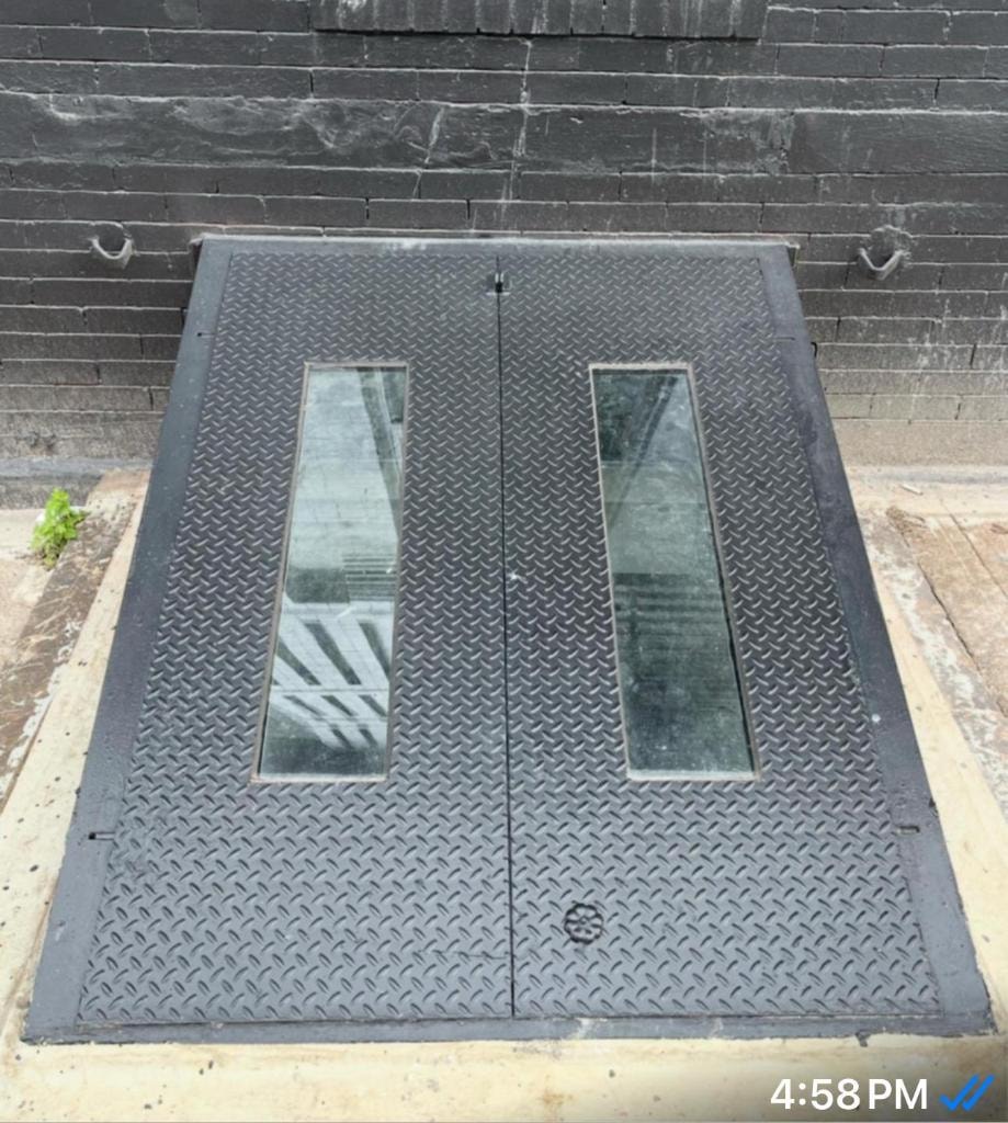 Metal basement doors with windows closed