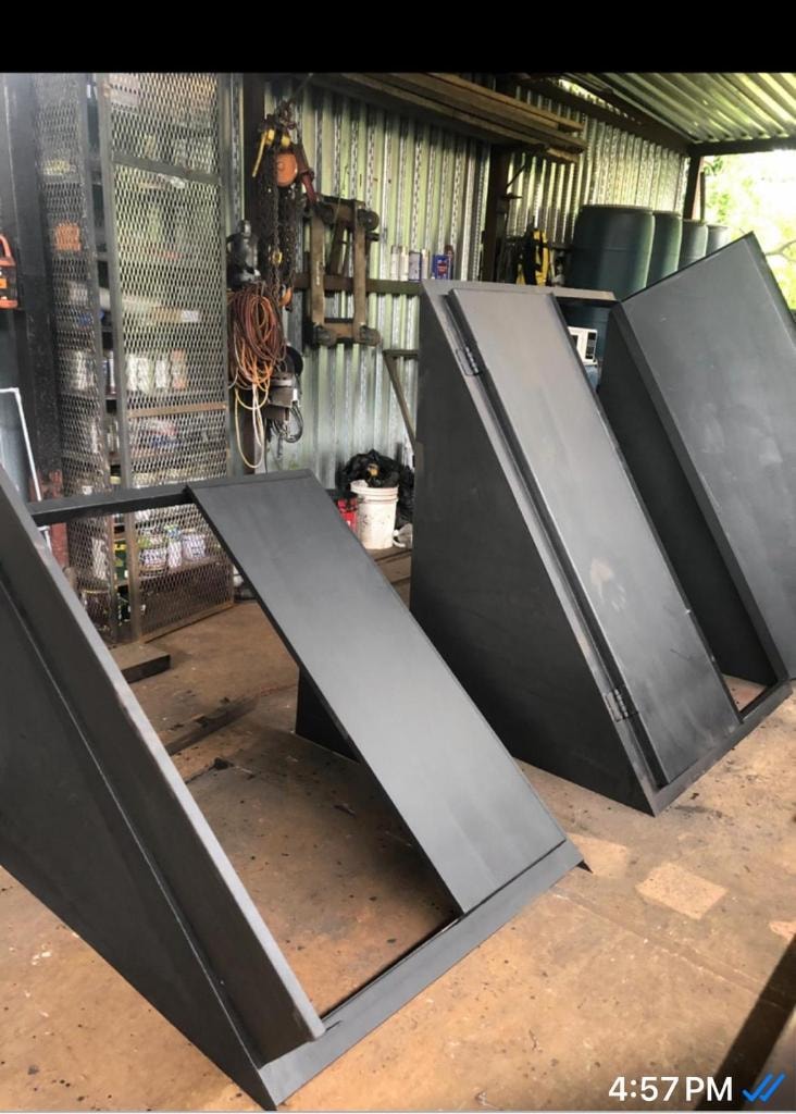 Black cellar doors fabricated and standing in workshop