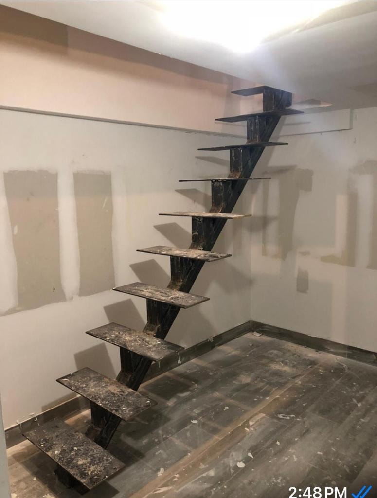 Interior floating staircase steel frame under construction
