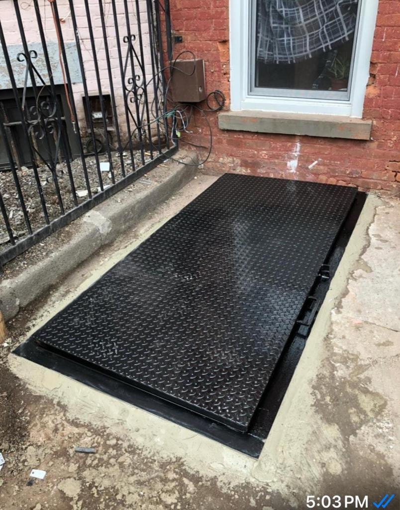 Black metal ramp brick building entrance