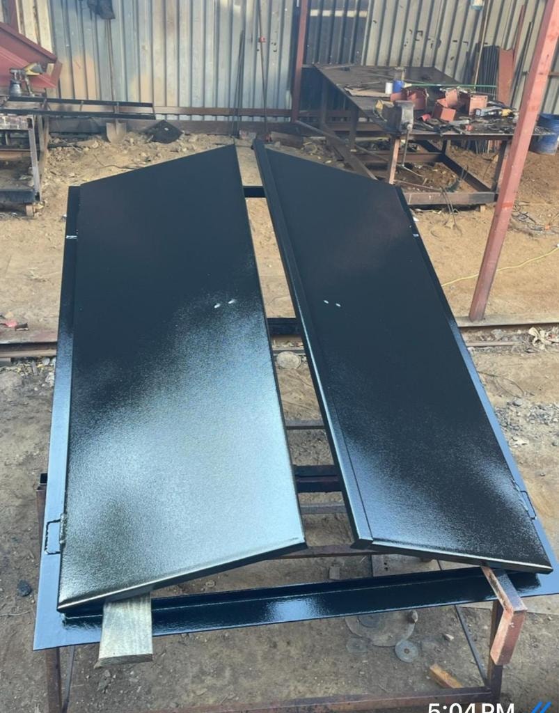 Metal fabrication workshop — steel door panels